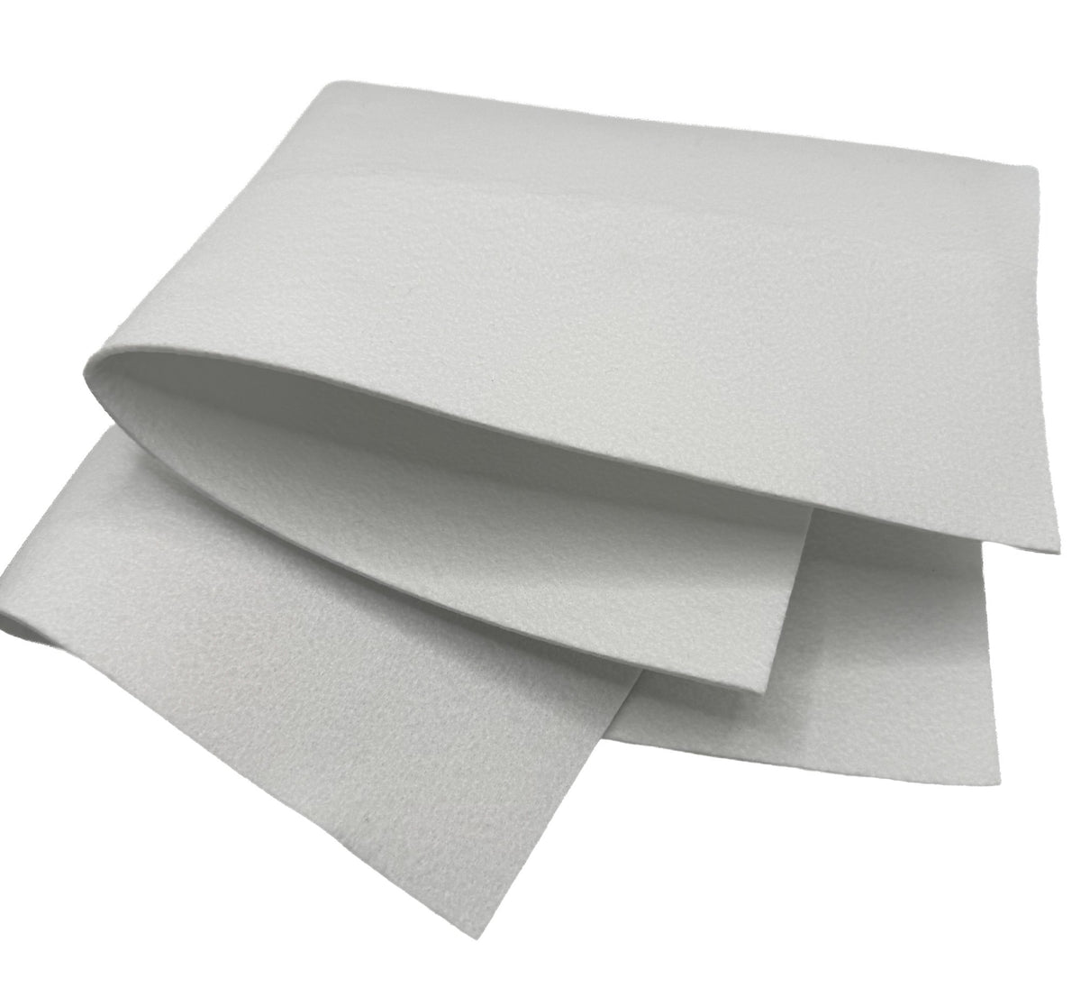 Orlon flat filter folded over to show the thickness of the 16 oz polyester felt