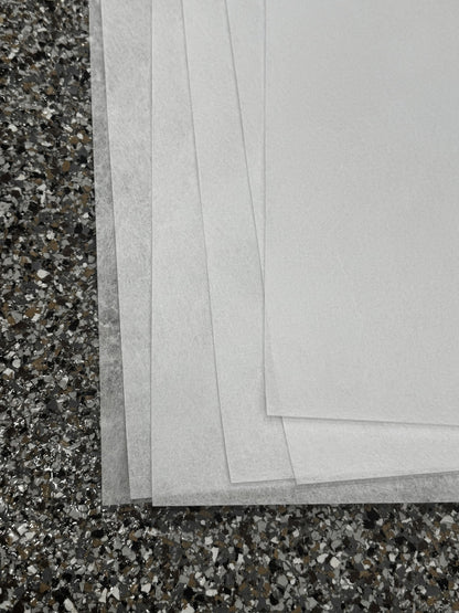 Stacked edges of Reemay flat prefilter sheets showing the thin spunbond polyester